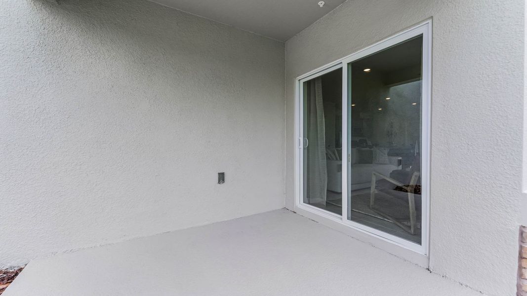 Exterior details and patio area of a home in Windrose, Apopka (Image 2).