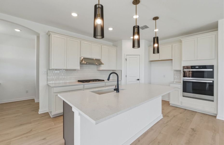 Representative furnished interior of a home built from the Lochridge by Pulte Homes in Woodside, Georgetown (Image 7).