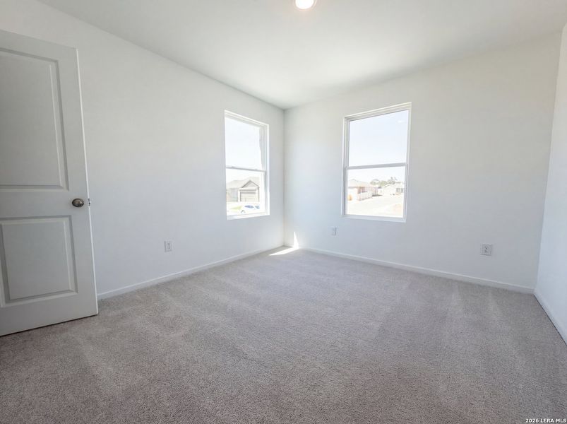 Spacious, unfurnished interior of a new home in Hunters Ranch, San Antonio (Image 11).