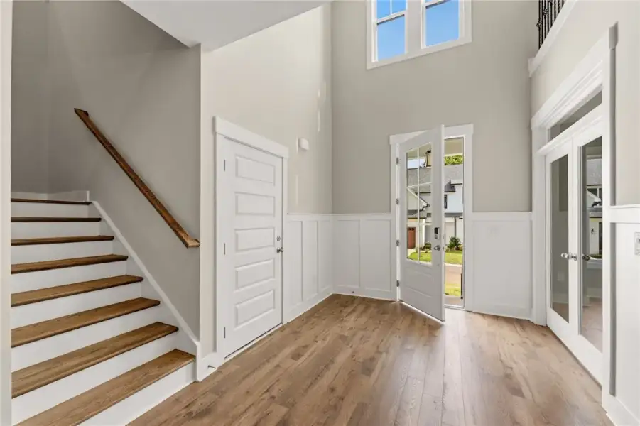A spacious foyer welcomes you with high ceilings, A spacious foyer welcomes you with high ceilings,