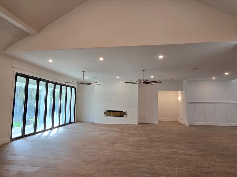 Livingroom with fireplace, folding glass doors.