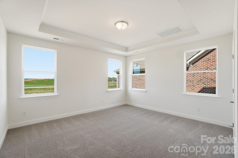 Primary Bedroom w/ tray ceiling