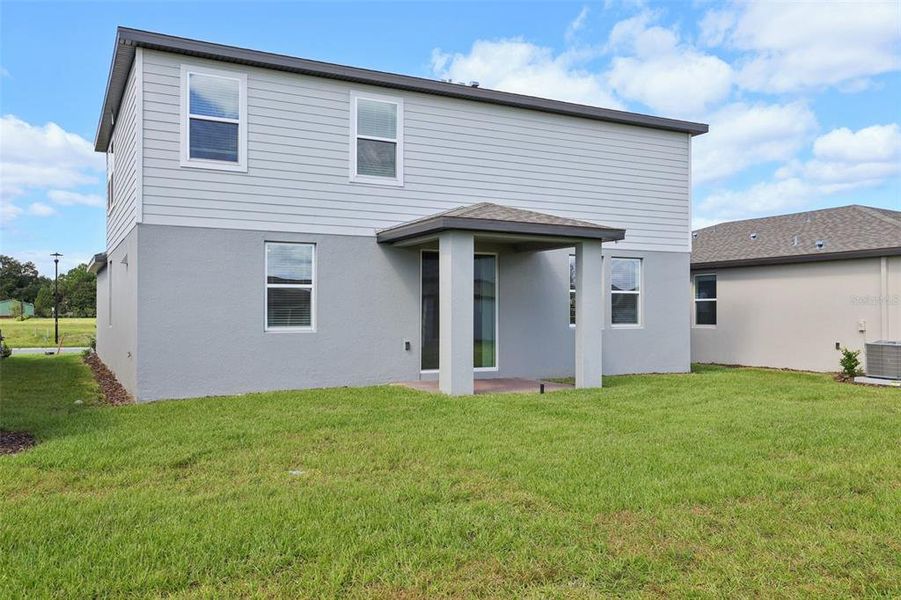 Exterior details and patio area of a home in The Reserve at Twin Lakes, St. Cloud (Image 17).