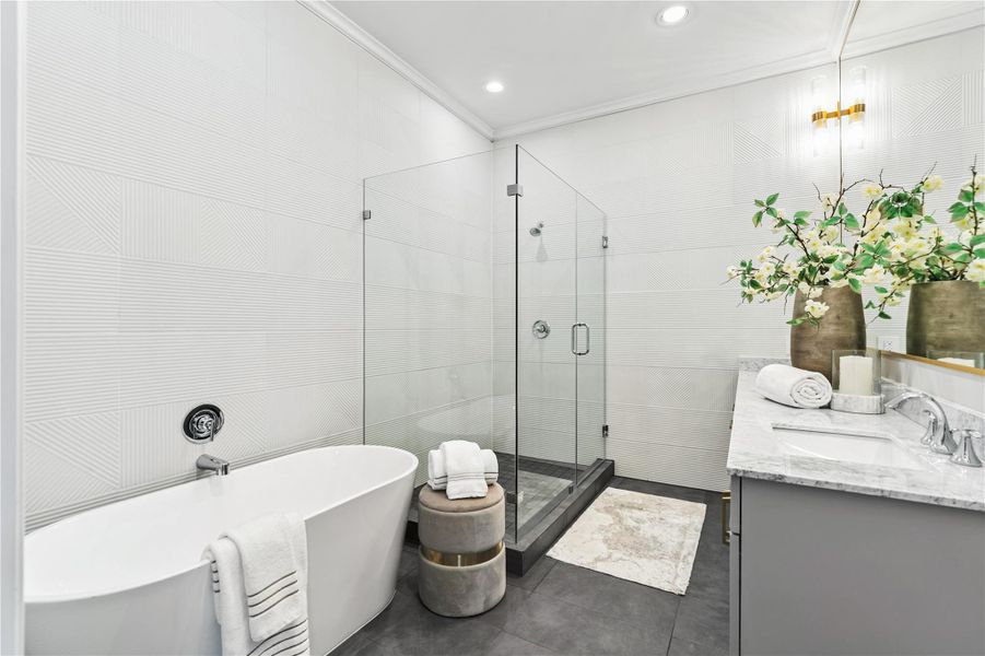 Gorgeous primary bathroom with soaking tub and skylight
