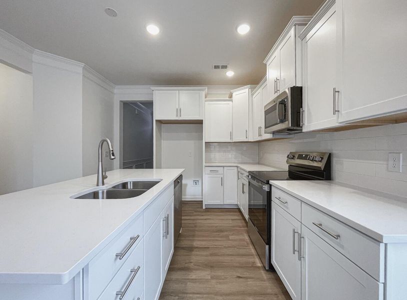 Furnished interior view inside a new home in East Main Townes, Spartanburg (Image 8). Furnished interior view inside a new home in East Main Townes, Spartanburg (Image 8).