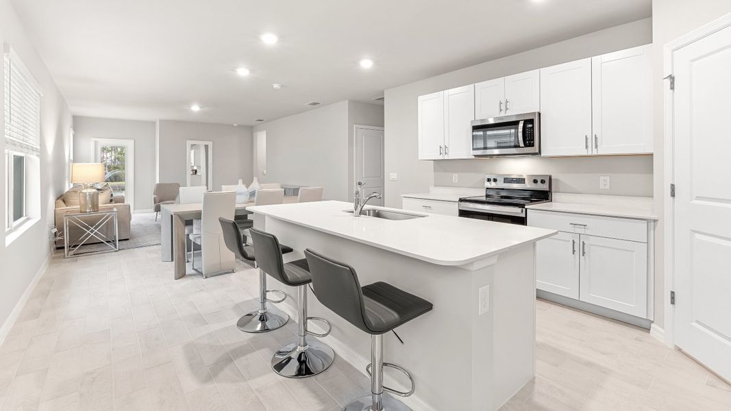 Representative furnished interior of a home built from the HARPER by D.R. Horton in Coral Bay - Express & Tradition, North Fort Myers (Image 8).
