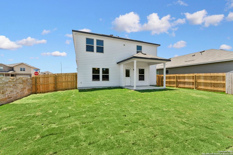 Front exterior of a new home in Cinco Lakes, San Antonio, TX, highlighting curb appeal (Image 13). Front exterior of a new home in Cinco Lakes, San Antonio, TX, highlighting curb appeal (Image 13).