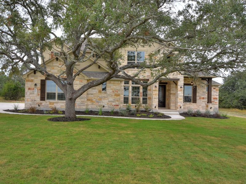 Representative exterior photo of a completed home built from the Madera II by Giddens Homes in Scofield Farms Estates, Georgetown, TX (Image 56).