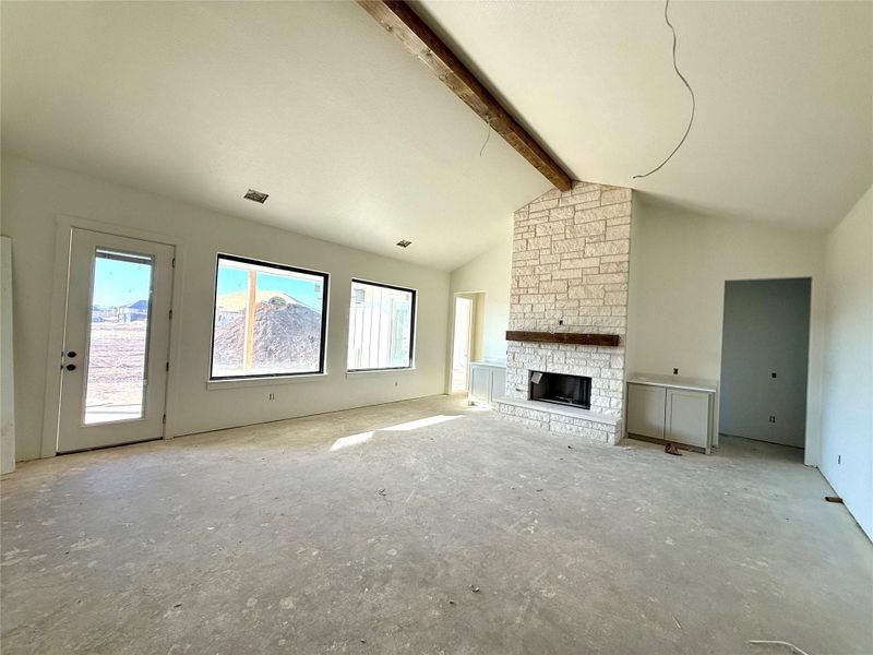 Unfurnished living room with a fireplace Unfurnished living room with a fireplace
