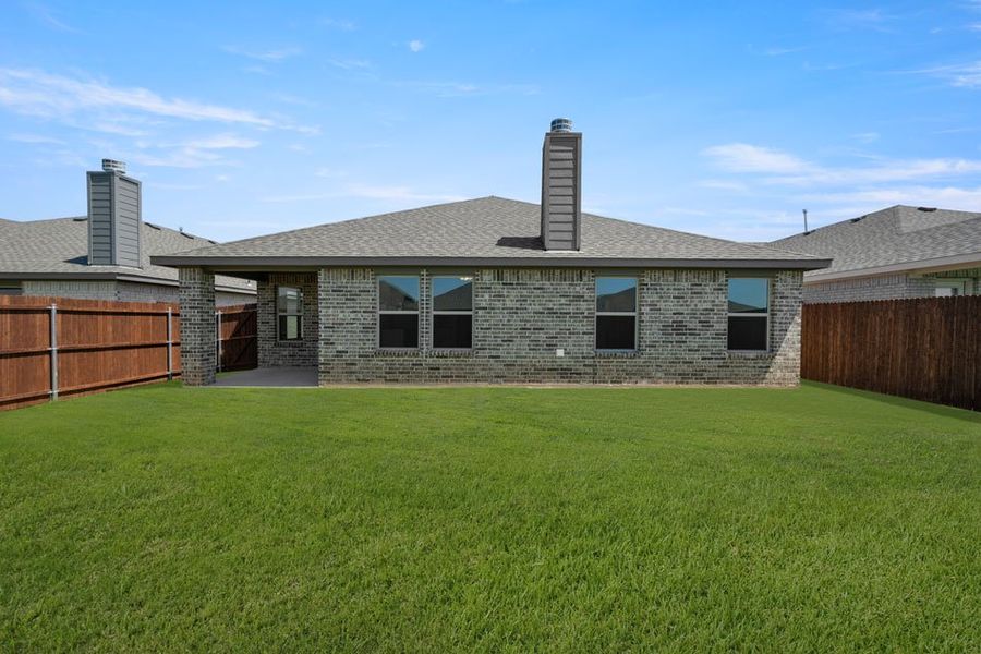 Representative exterior photo of a completed home built from the Cheyenne by Impression Homes in Baker Farms, Cleburne, TX (Image 22).