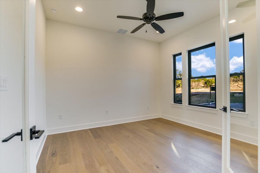 Office featuring recessed lighting, light wood-style flooring, and a ceiling fan