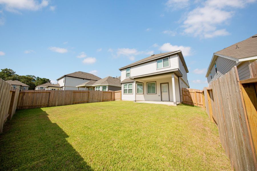 Exterior details and patio area of a home in River's Edge, Conroe (Image 3). Exterior details and patio area of a home in River's Edge, Conroe (Image 3).