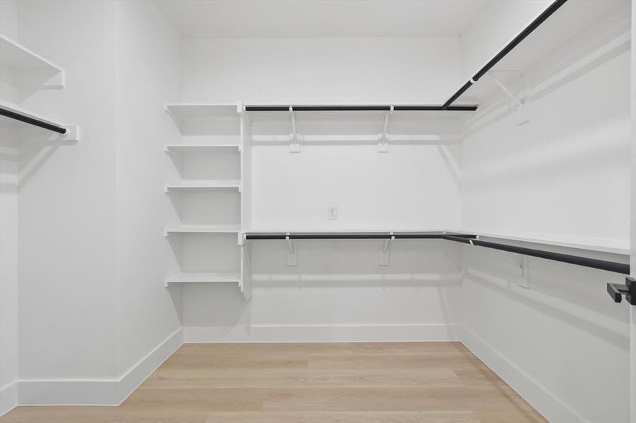 Walk in closet featuring light wood-type flooring