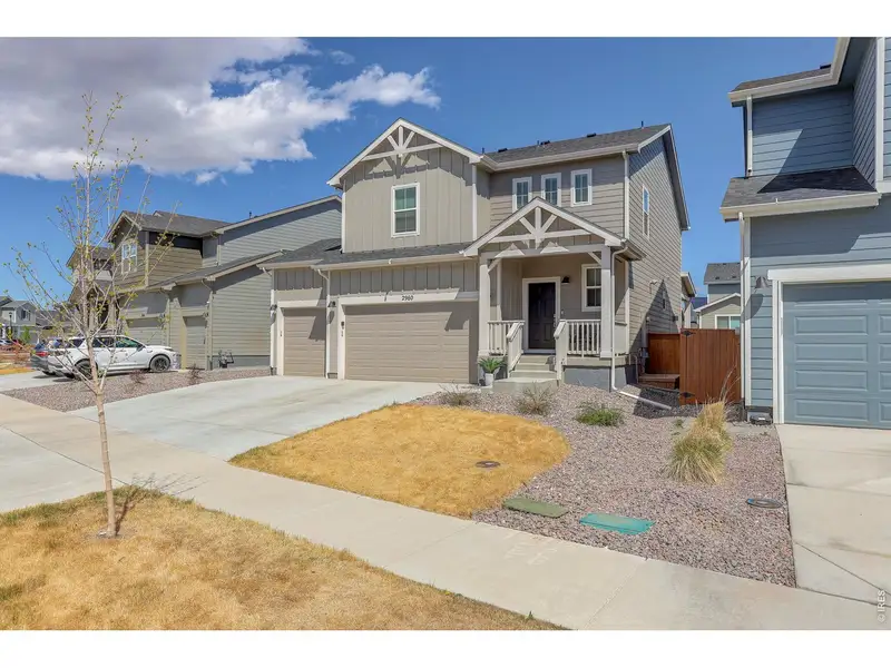 Front exterior of a new home in Mountain Brook, Longmont, CO, highlighting curb appeal (Image 26).