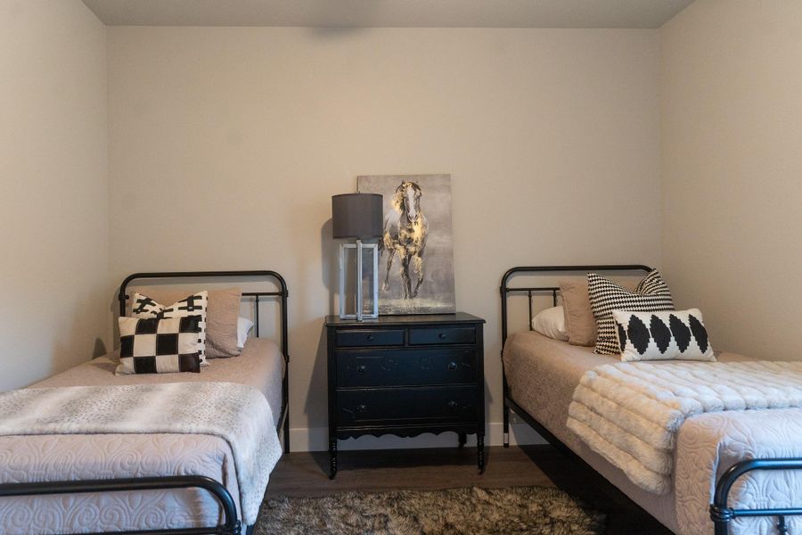 Bedroom featuring wood finished floors Bedroom featuring wood finished floors