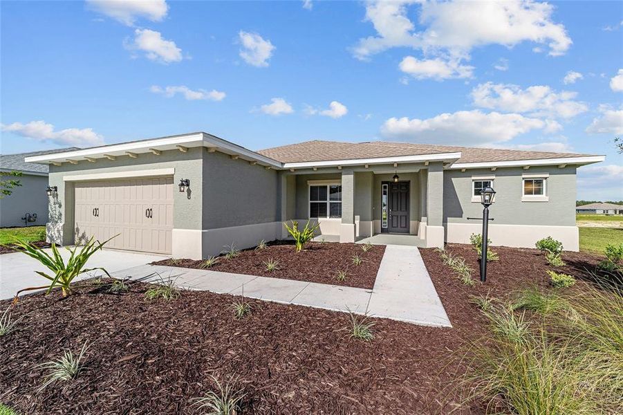 Front exterior of a new home in On Top of the World Communities, Ocala, FL, highlighting curb appeal (Image 18).