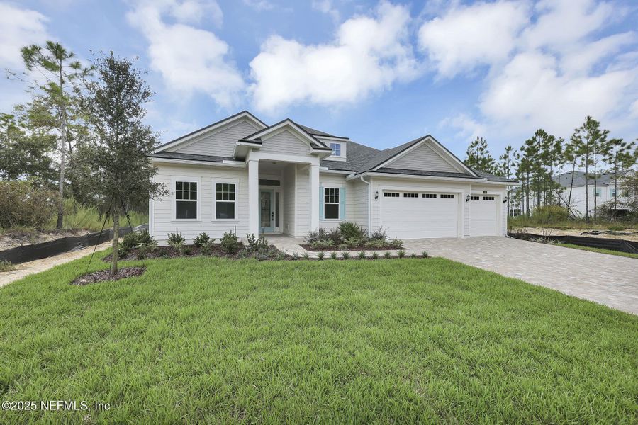 Front exterior of a new home in Hidden Creek at SilverLeaf, St. Augustine, FL, highlighting curb appeal (Image 20).
