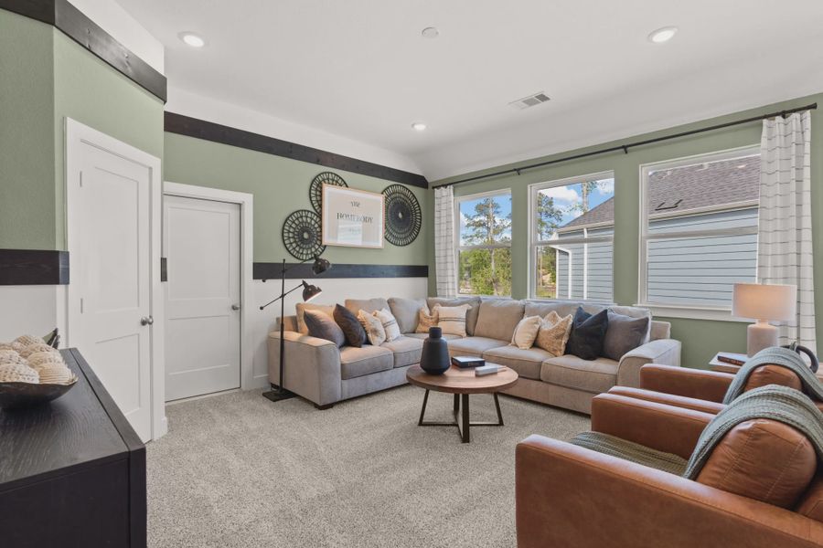 Representative furnished interior of a home built from the Versailles by Chesmar Homes in The Woodland Hills Chateau, Willis (Image 10).