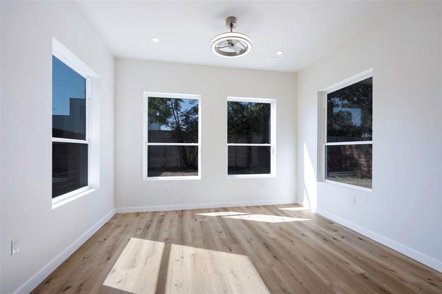 Dining area with a wealth of natural light and light hardwood / wood-style flooring