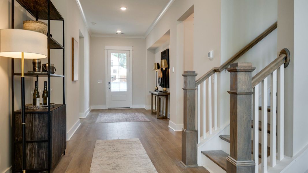 Living area next to hallway and staircase