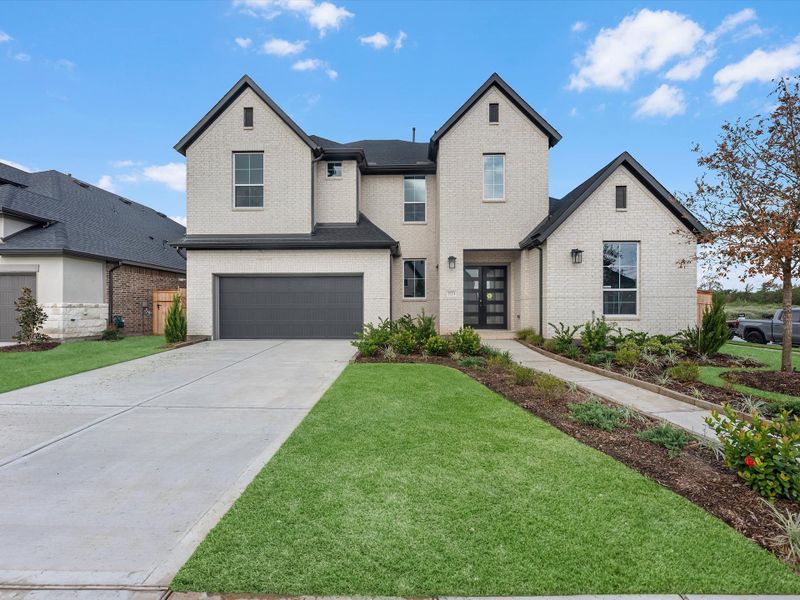 Front exterior of a new home in Sienna 60’, Missouri City, TX, highlighting curb appeal (Image 2). Front exterior of a new home in Sienna 60’, Missouri City, TX, highlighting curb appeal (Image 2).