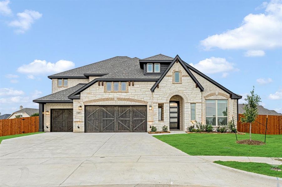 Front exterior of a new home in Sunrise at Garden Valley 60-79, Waxahachie, TX, highlighting curb appeal (Image 25).