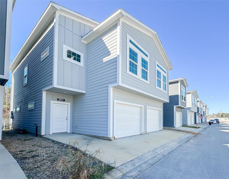 Front exterior of a new home in , Spring, TX, highlighting curb appeal (Image 15).