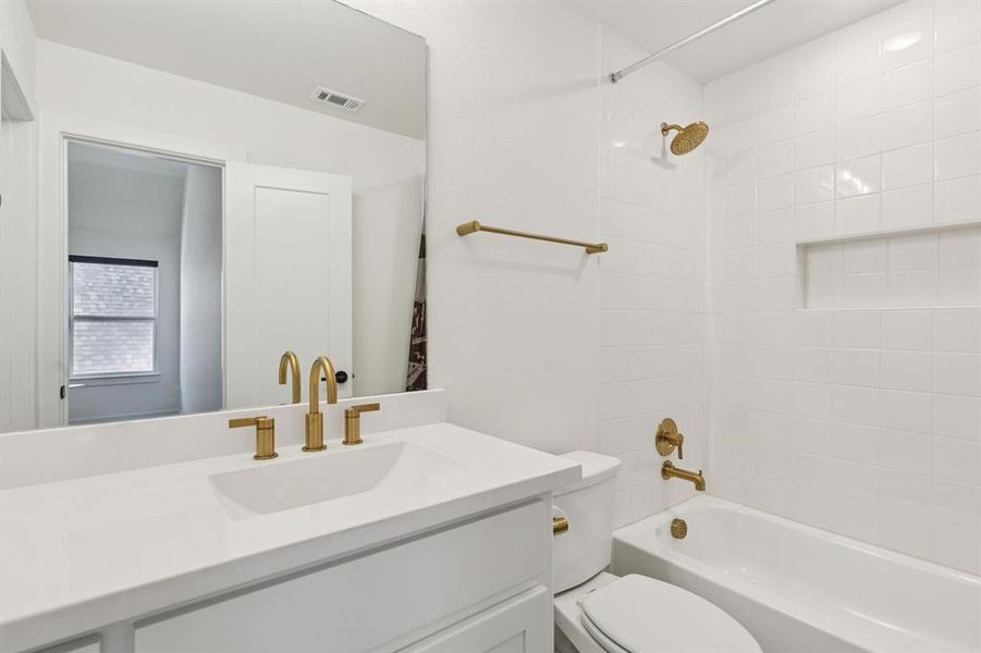 Full bathroom featuring vanity and  shower combination