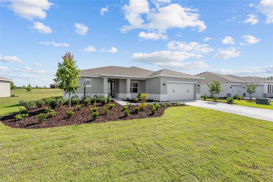 Front exterior of a new home in , Ocala, FL, highlighting curb appeal (Image 2). Front exterior of a new home in , Ocala, FL, highlighting curb appeal (Image 2).