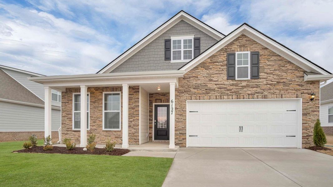 Front exterior of a new home in Legacy Farms, White House, TN, highlighting curb appeal (Image 1). Front exterior of a new home in Legacy Farms, White House, TN, highlighting curb appeal (Image 1).