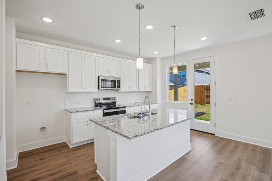 Furnished interior view inside a new home in Freedom at Anthem, Kyle (Image 5). Furnished interior view inside a new home in Freedom at Anthem, Kyle (Image 5).