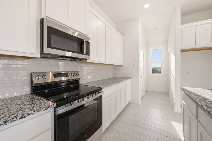 Furnished interior view inside a new home in Saddleback Estates, Boyd (Image 11).