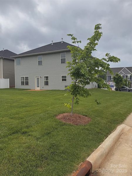 Front exterior of a new home in Village at Parkside, Gastonia, NC, highlighting curb appeal (Image 2).