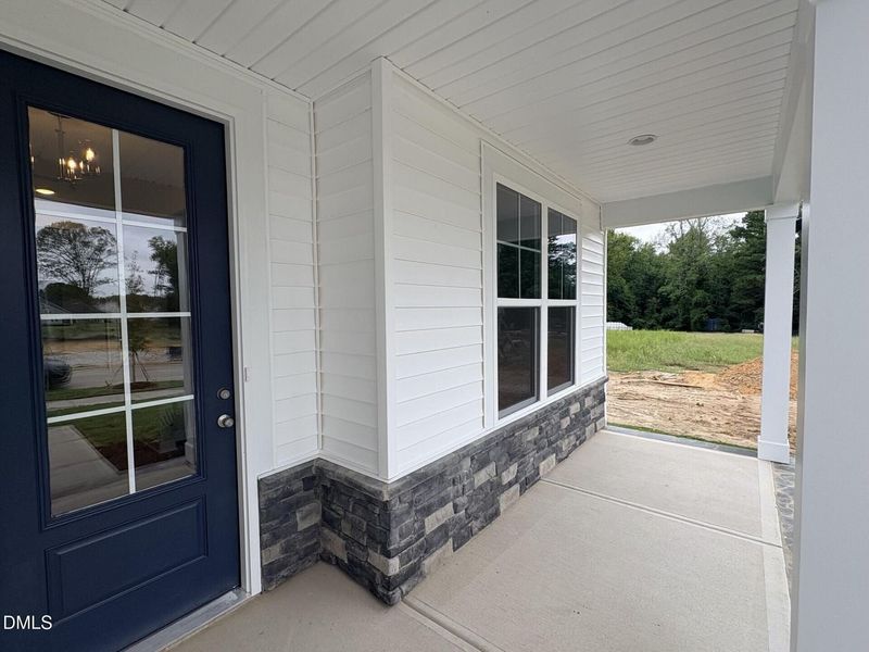 Exterior details and patio area of a home in Woodland Crossing, Zebulon (Image 3).
