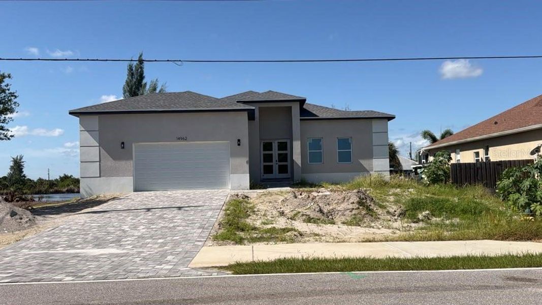Front exterior of a new home in , Port Charlotte, FL, highlighting curb appeal (Image 2). Front exterior of a new home in , Port Charlotte, FL, highlighting curb appeal (Image 2).