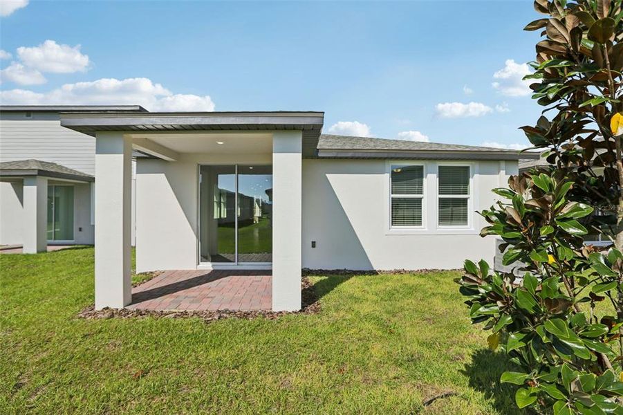 Exterior details and patio area of a home in Springs at Lake Alfred - Classic Series, Lake Alfred (Image 22).