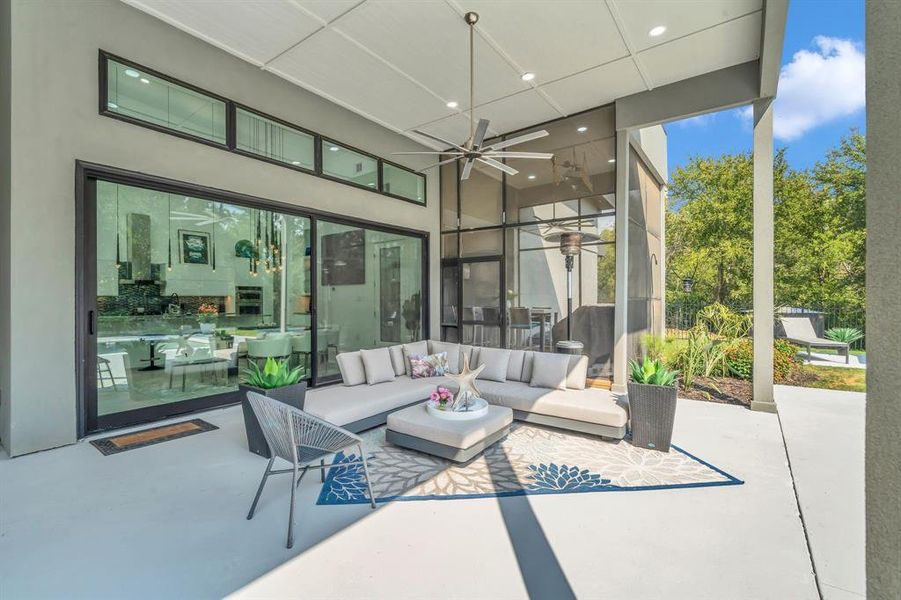 View of patio / terrace featuring a ceiling fan and an outdoor hangout area