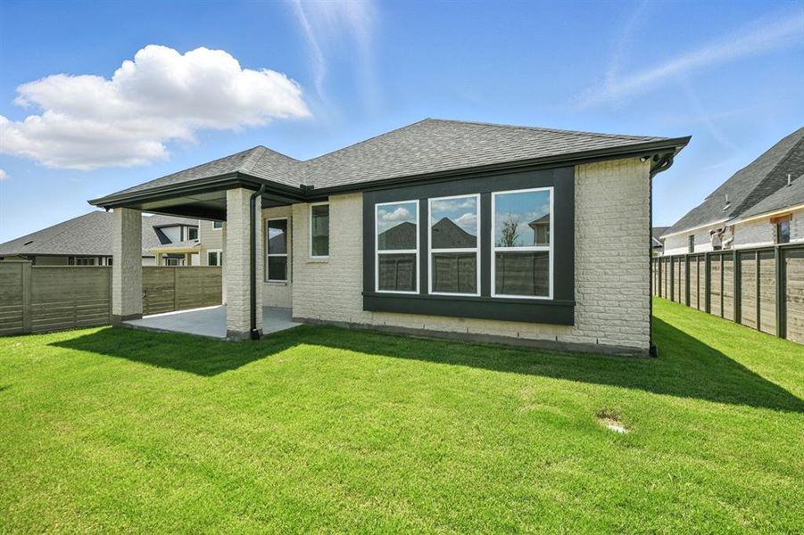 Exterior details and patio area of a home in Treeline, Justin (Image 21).