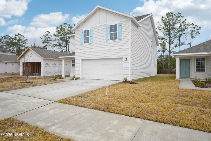 Front exterior of a new home in Kings Landing, Jacksonville, FL, highlighting curb appeal (Image 8). Front exterior of a new home in Kings Landing, Jacksonville, FL, highlighting curb appeal (Image 8).