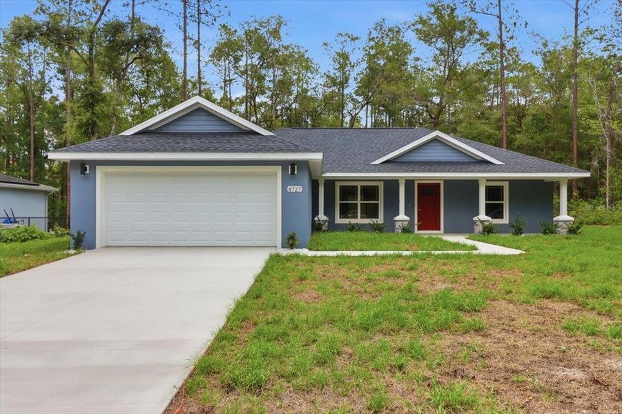 Front exterior of a new home in , Dunnellon, FL, highlighting curb appeal (Image 19).