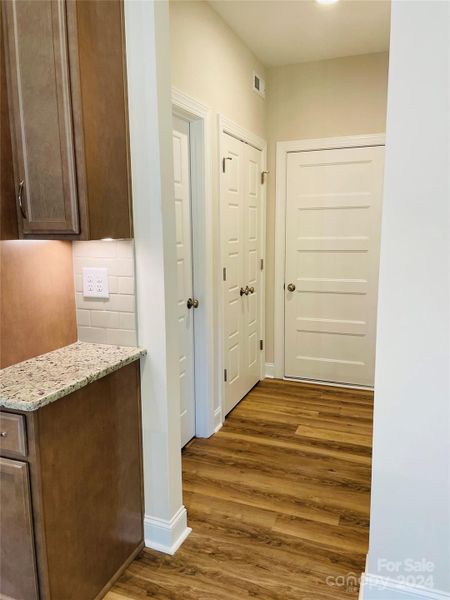 Hallway to Laundry, Storage Closet & Garage