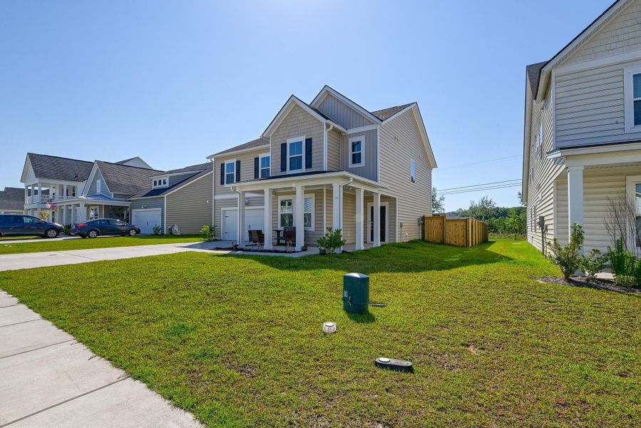Front exterior of a new home in Heron's Walk at Summers Corner, Summerville, SC, highlighting curb appeal (Image 22).