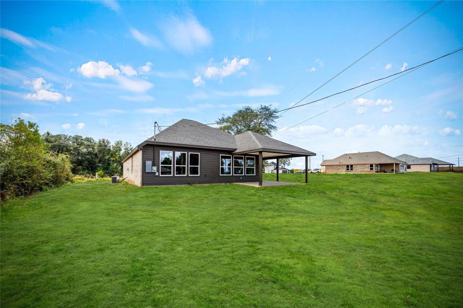 Exterior details and patio area of a home in , Prairie View (Image 16).