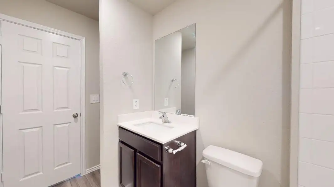 Bathroom with vanity and wood finished floors