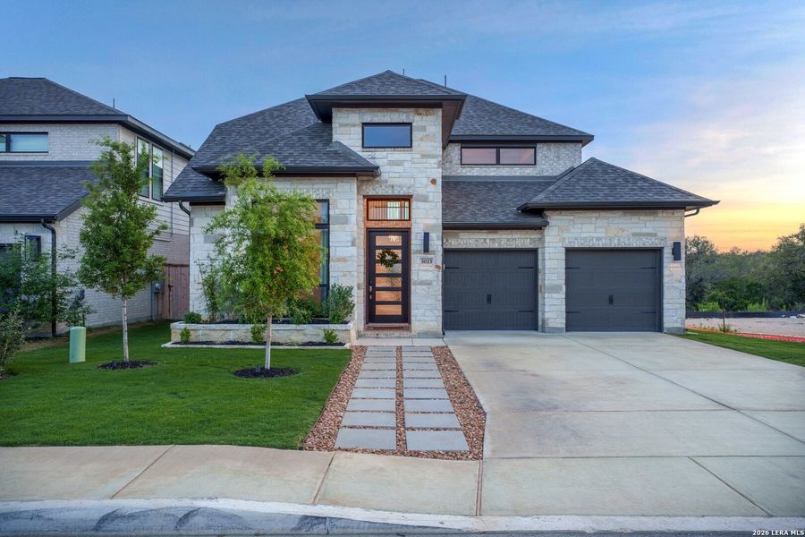 Front exterior of a new home in Ladera, San Antonio, TX, highlighting curb appeal (Image 24). Front exterior of a new home in Ladera, San Antonio, TX, highlighting curb appeal (Image 24).