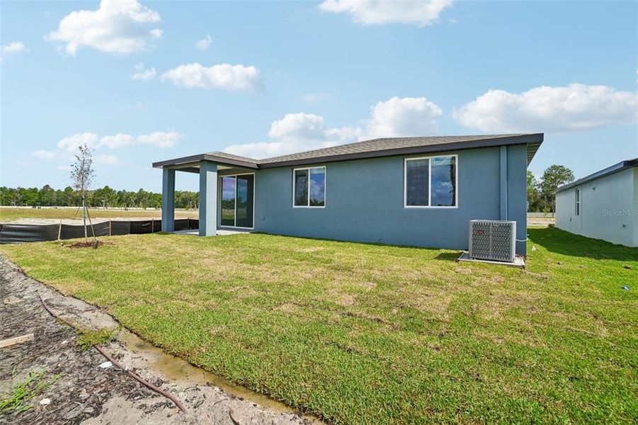 Exterior details and patio area of a home in Pine Ridge Meadows, Hudson (Image 3).