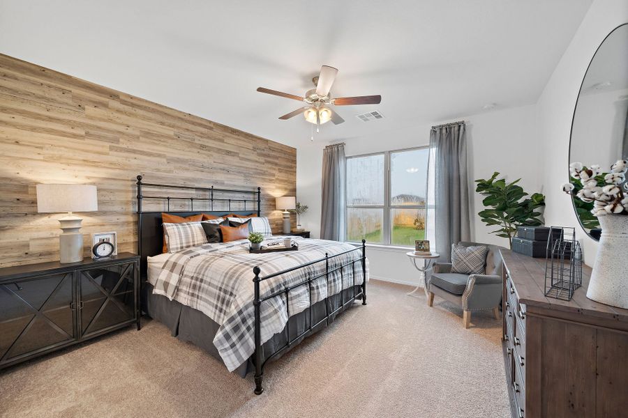 A bedroom with a large bed. A bedroom with a large bed.