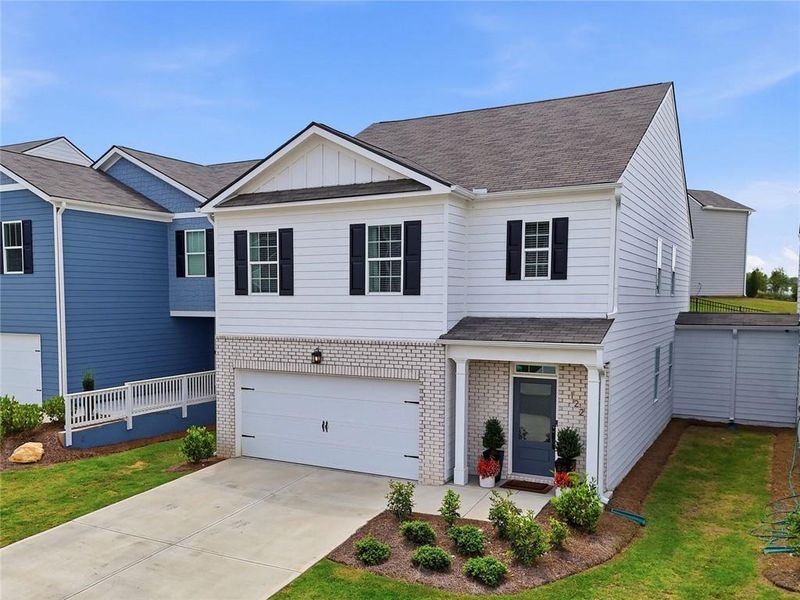 Front exterior of a new home in Rolling Meadows, Jasper, GA, highlighting curb appeal (Image 22). Front exterior of a new home in Rolling Meadows, Jasper, GA, highlighting curb appeal (Image 22).