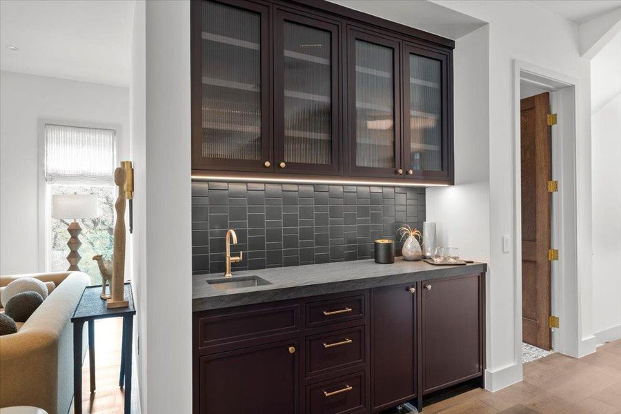 The bar houses a Scotsman icemaker as well as a Sub Zero under counter fridge.