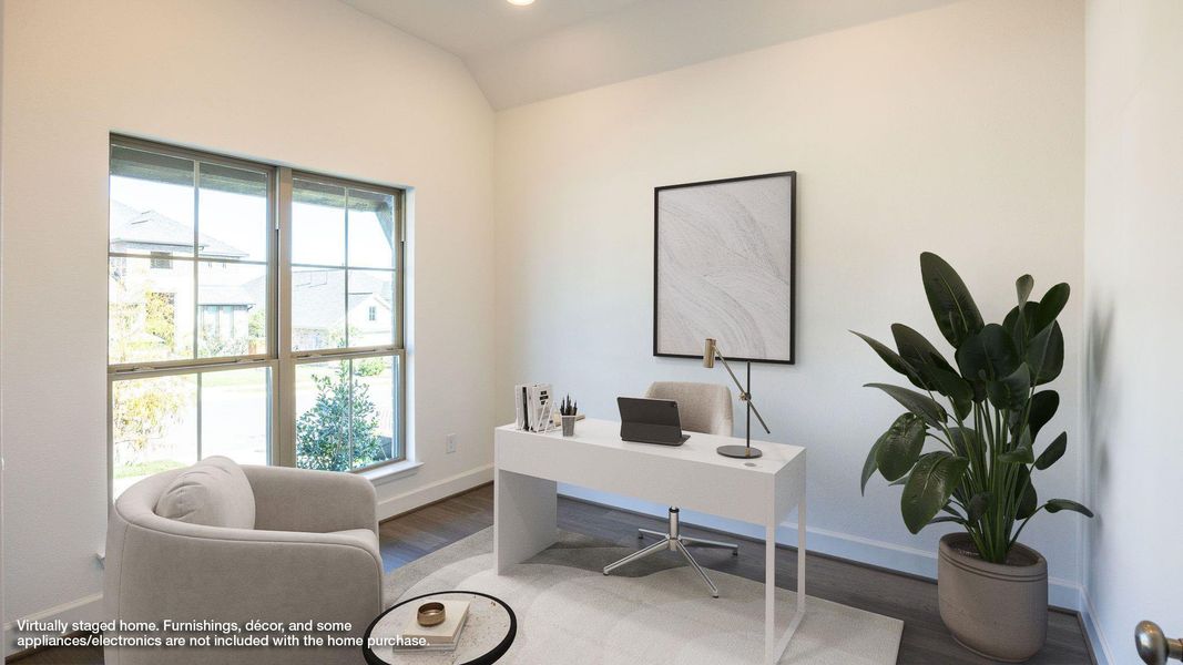 Office with wood finished floors and lofted ceiling Office with wood finished floors and lofted ceiling